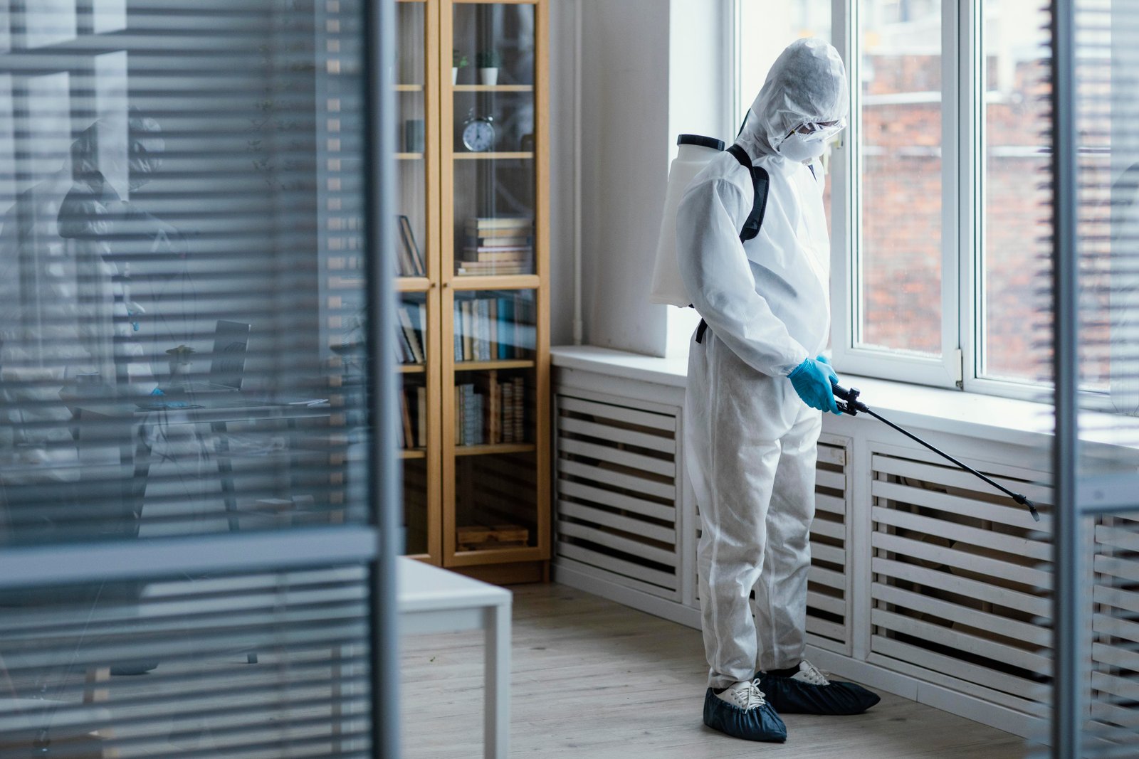 People disinfecting biohazard area 2
